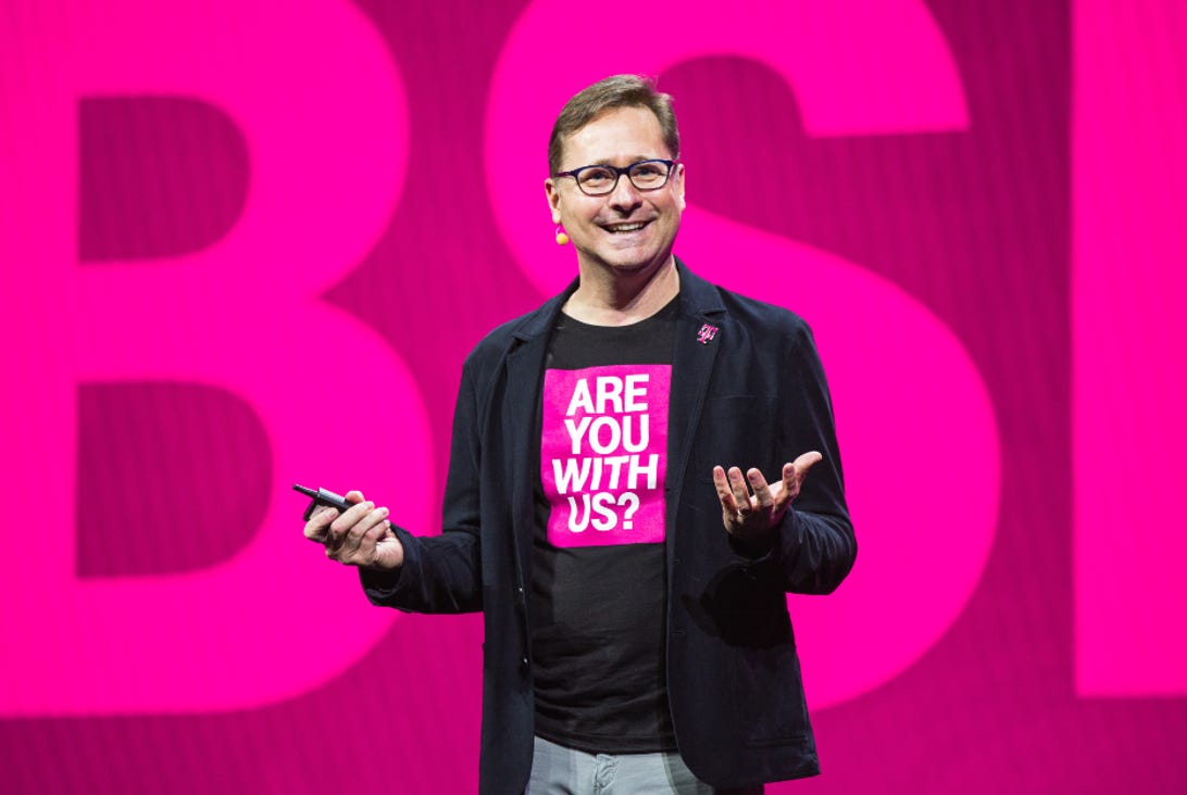 Mike Sievert wearing a T-Mobile shirt that says